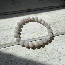 Load image into Gallery viewer, Mother of Pearl Stretch Bracelet – Iridescent Glow &amp; Timeless Elegance
